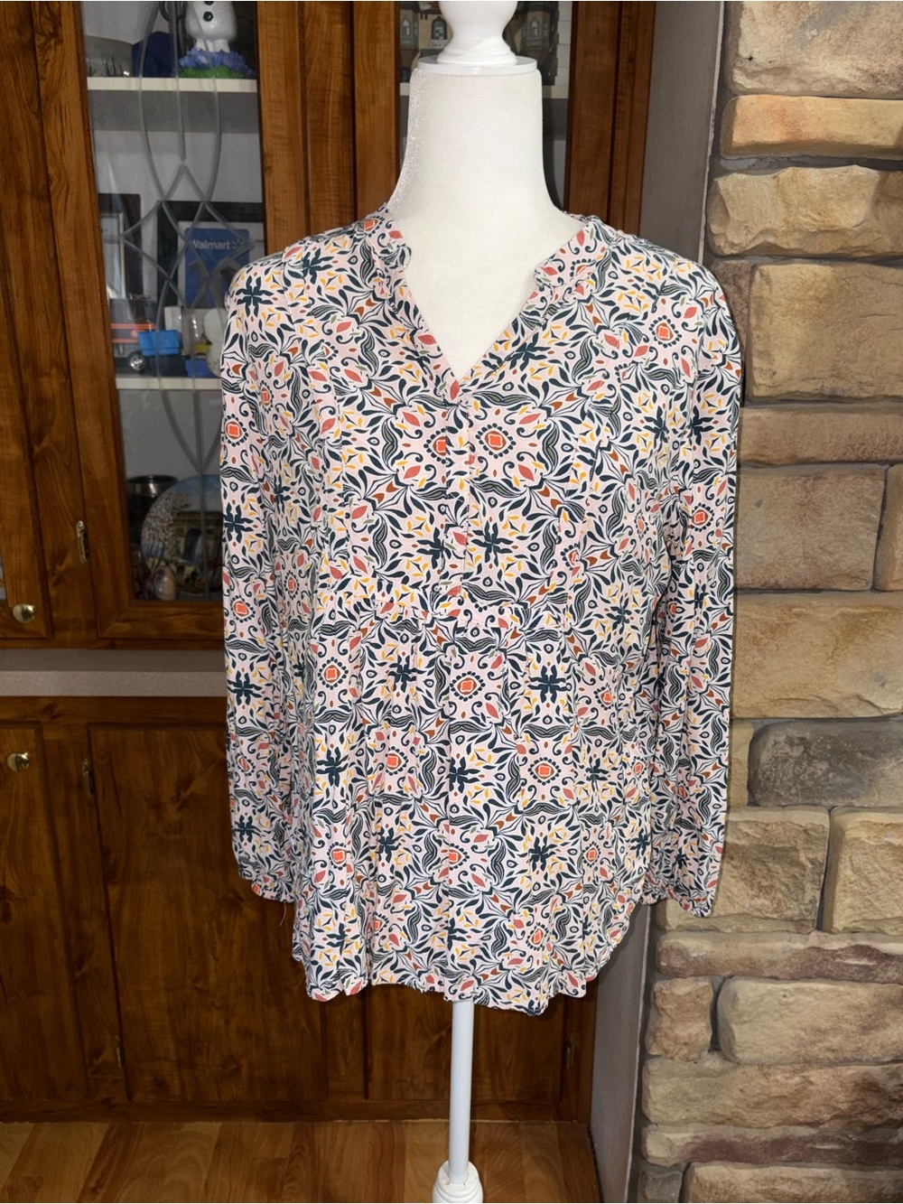 Loft size large multicolored v/neck w/ hidden buttons very light pink background